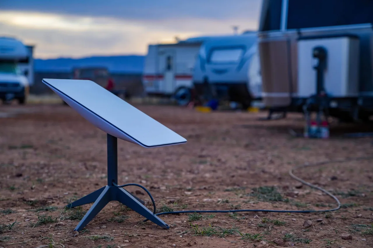 A table in the middle of an open field.