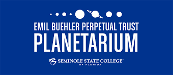 A blue shirt with planets and the words " planetarium ".
